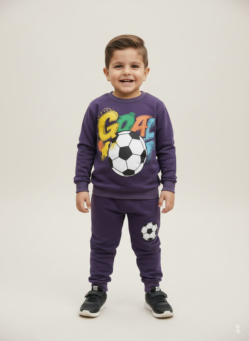 Professional studio product image of child wearing navy blue GOAL soccer tracksuit